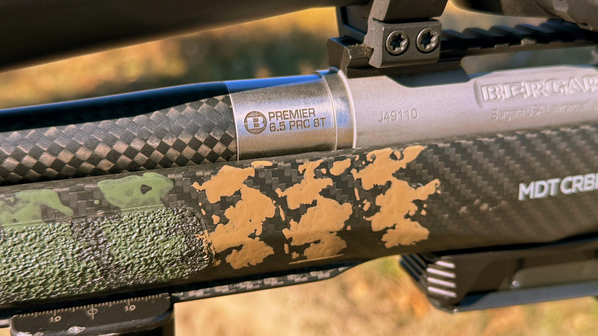 Close-up of the MDT CRBN carbon fiber stock and Bergara Cure carbon barrel on the 6.5 PRC rifle