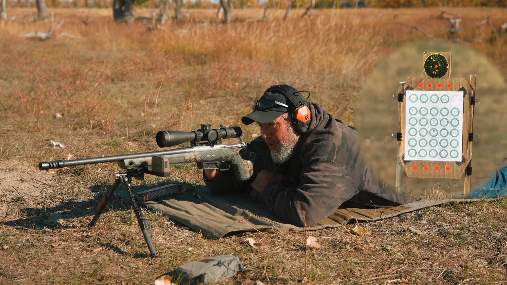 Joel prone behind the 6.5 PRC rifle shooting Hornady 143 grain ELD-X ammo at a 100 yard target
