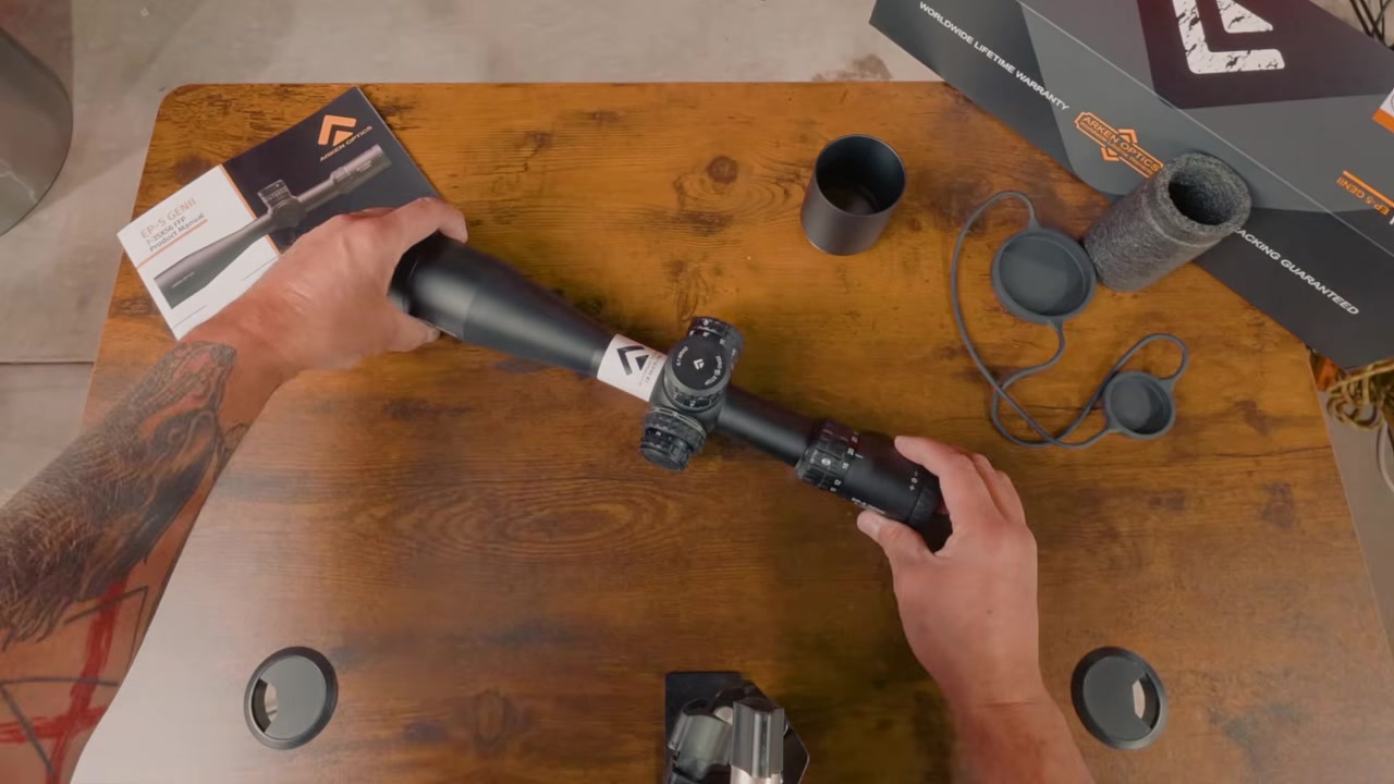 Joel holding the Arken EP5 Gen 2 scope over the workbench during the final thoughts