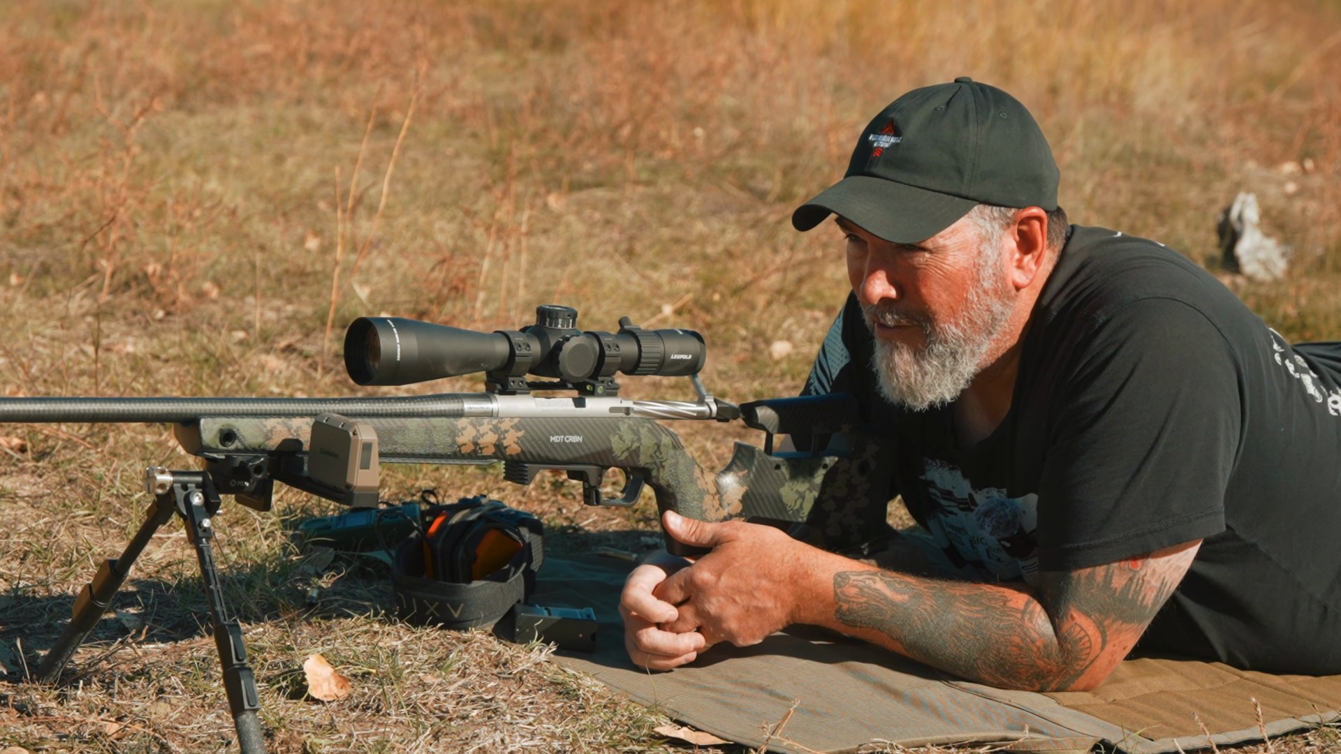 Joel prone next to his 6.5 PRC elk rifle giving his final thoughts on the ammo test